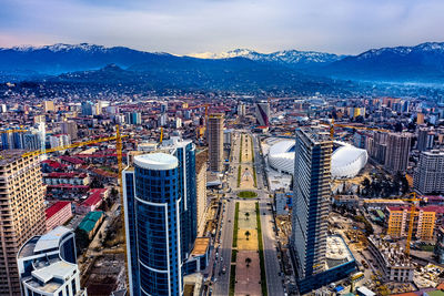 High angle view of city buildings against sky