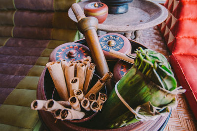 High angle view of leaves and containers on table