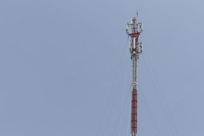 Low angle view of communications tower against sky