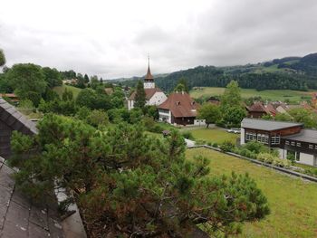 Panoramic view of trees and buildings against sky