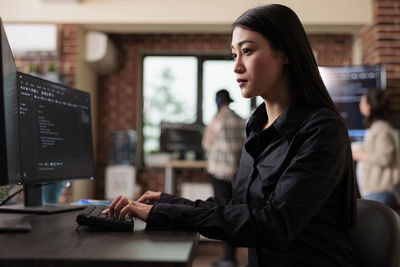 Computer programmer working at office