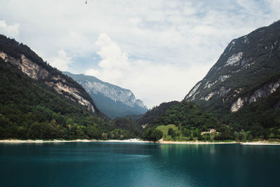 Scenic view of lake and mountains against sky