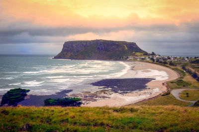 Scenic view of sea against sky at sunset