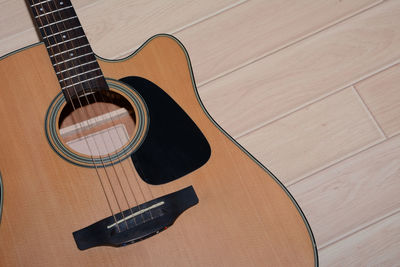 High angle view of guitar on table