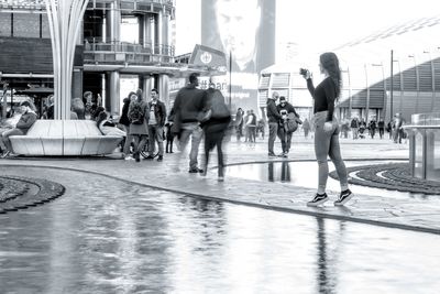 People walking on street in city