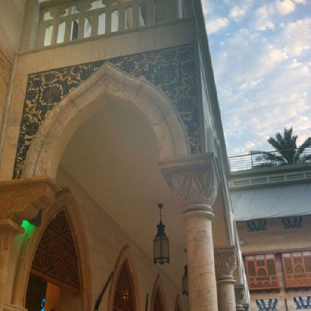 architecture, built structure, low angle view, building exterior, arch, place of worship, religion, sky, spirituality, church, architectural feature, window, building, dome, architectural column, ornate, travel destinations, day, no people