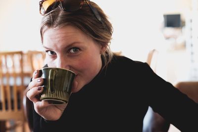 Portrait of woman drinking coffee