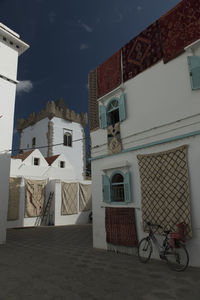 Houses against sky in city