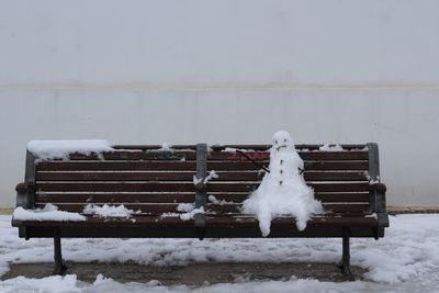 White snow covered bench