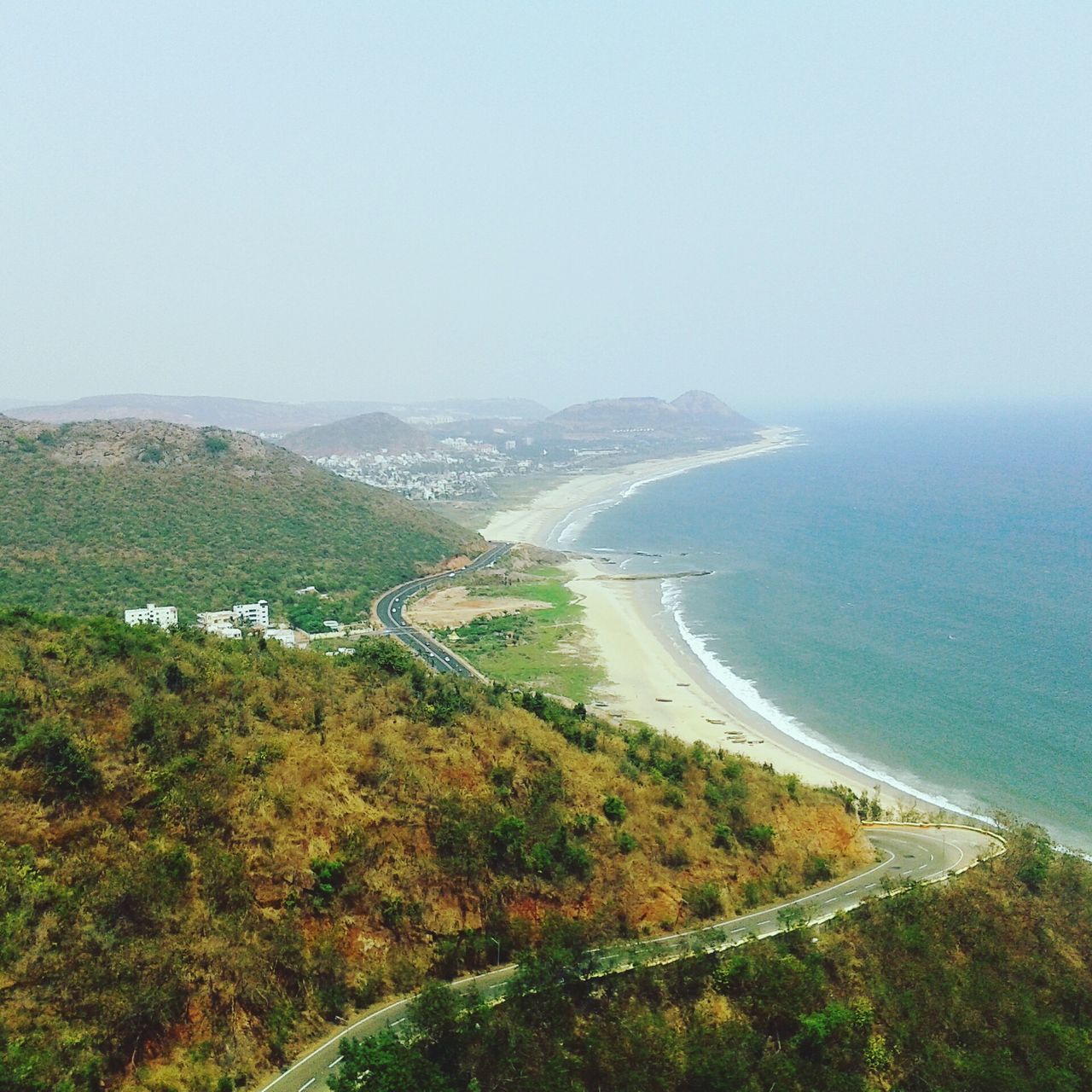 scenics, beauty in nature, mountain, sea, nature, tranquil scene, landscape, no people, water, tranquility, sky, day, growth, outdoors, tree