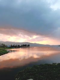 Scenic view of sea against sky at sunset