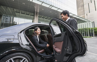 Side view of a young woman in car