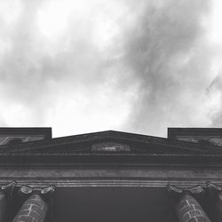 Low angle view of building against cloudy sky