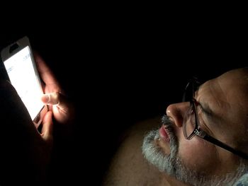 Close-up of man using mobile phone