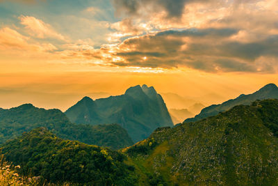 Beautiful scenic mountain background with blue sky, cloud and blast horizon sun