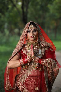 Midsection of woman standing in temple