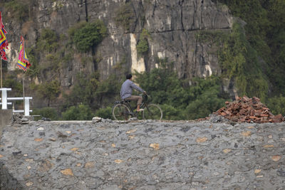 Potrait of a vietnamese man with a bike
