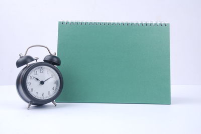 Close-up of clock on table