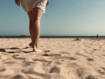 Low section of woman on beach