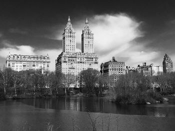 Buildings against cloudy sky