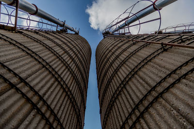 Low angle view of industrial building against sky