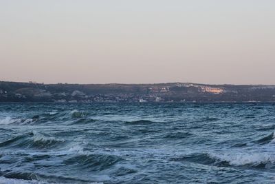 Scenic view of sea against sky during winter