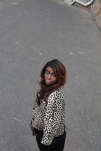 Young woman standing on street