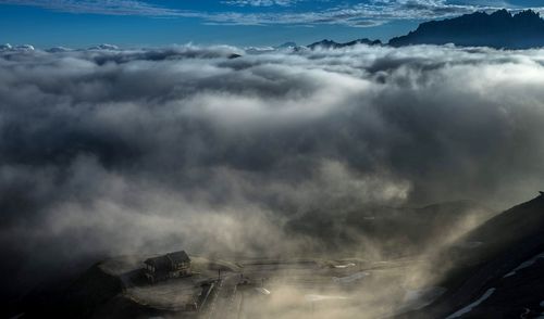 Aerial view of clouds over mountain