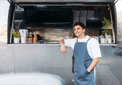 Portrait of smiling young man standing outdoors