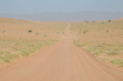 Dirt road passing through a desert