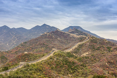 Scenic view of mountain against cloudy sky