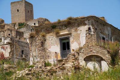 Low angle view of old ruins against sky