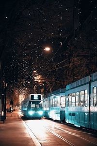 Illuminated street at night in zurich, switzerland