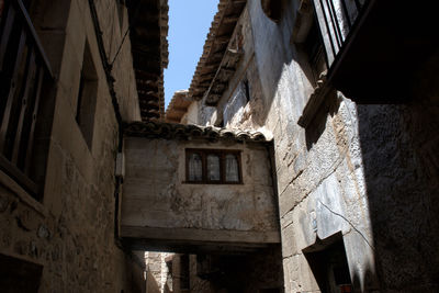 Low angle view of old buildings against sky