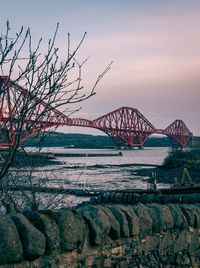 Scenic view of sea against clear sky and bridge