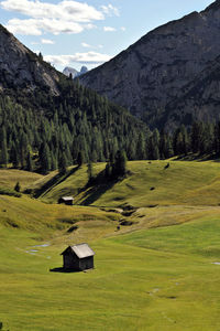 Green hills and mountain against sky