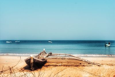 Scenic view of beach against clear sky