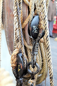 Close-up of rope tied up on wooden post