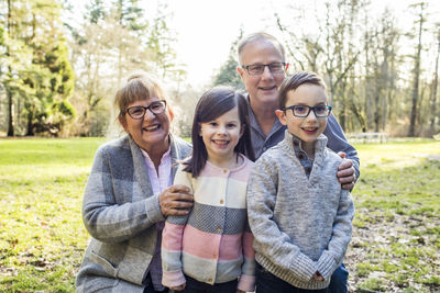 Grandparents pose for photo with their grandchildren.