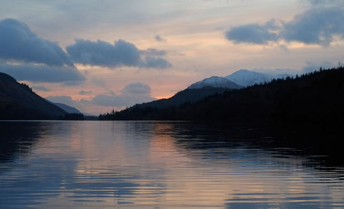 Scenic view of lake against sky during sunset