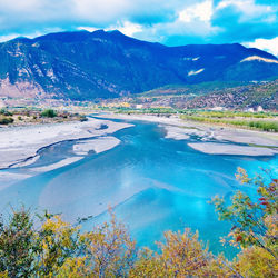 Scenic view of lake against cloudy sky