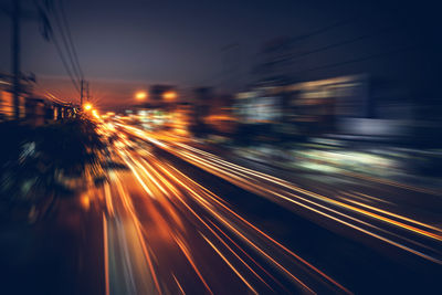 Blurred motion of light trails on street at night