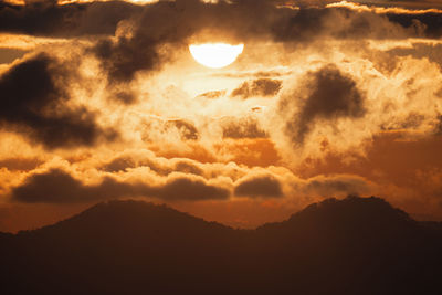 Low angle view of dramatic sky during sunset