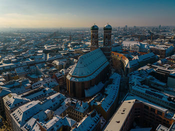 Snow-capped frauenkirche in munich, germany