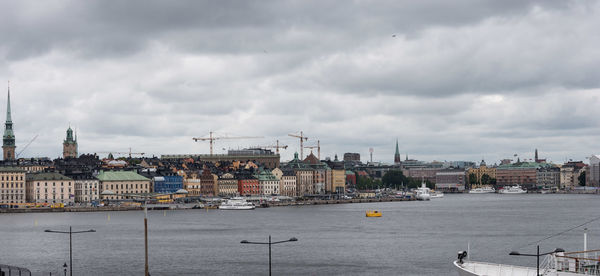 Cityscape against cloudy sky