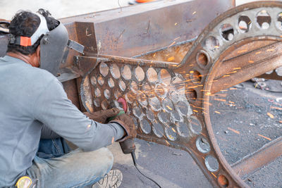 Man working on metal structure