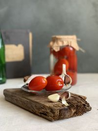 Close-up of tomatoes in jar on table