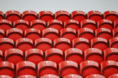 Low angle view of red folded bleachers in auditorium
