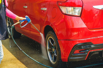 View of red car on street