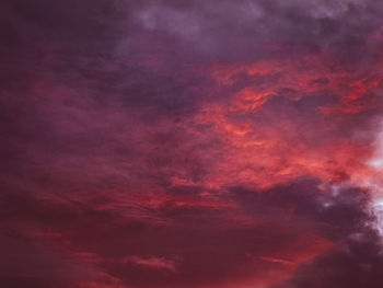 Low angle view of dramatic sky during sunset